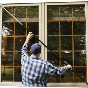Man Measuring Window